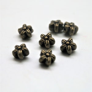 Floral beads metal bronze 7 mm