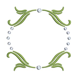 May include: A green leafy frame with white pearl accents. The frame is circular and has a decorative design.
