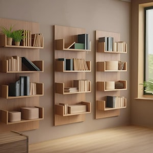 Set of three floating wall bookshelves arranged in a modern, minimal layout on a light wall, holding books and small décor; rectangular clean lines with smooth finish, ideal for living room, office or nursery; easy wall mounting.