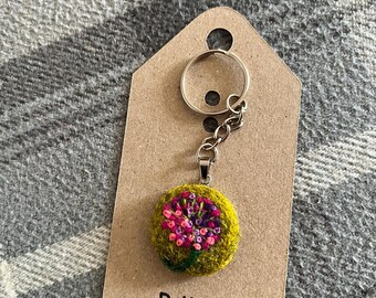 Pink Allium flower keychain, made using needle felting and embroidery attached to a silver colour keyfob