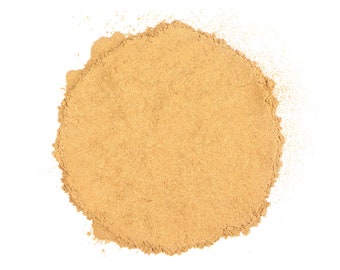 May include: A close-up of a pile of ground cinnamon, a warm brown spice, against a white background.