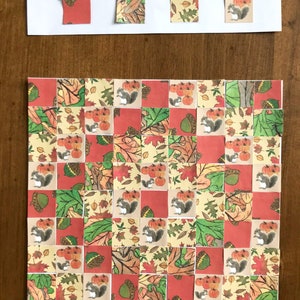 May include: A craft project with a grid of 9x9 squares. Each square has a different autumn-themed image, including squirrels, acorns, pumpkins, and leaves. The images are printed on paper and are ready to be cut out and glued onto a template.
