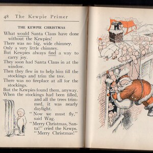 May include: An open book page with a vintage illustration of Santa Claus entering a window, surrounded by Kewpies. The text reads "The Kewpie Christmas" and describes Santa's visit. The illustration is in red, black, and white.