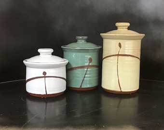 Petite Canister Set  Colorful, fully glazed inside.   3 piece; 4 1/2" each in diameter, 5", 6" & 8" tall.