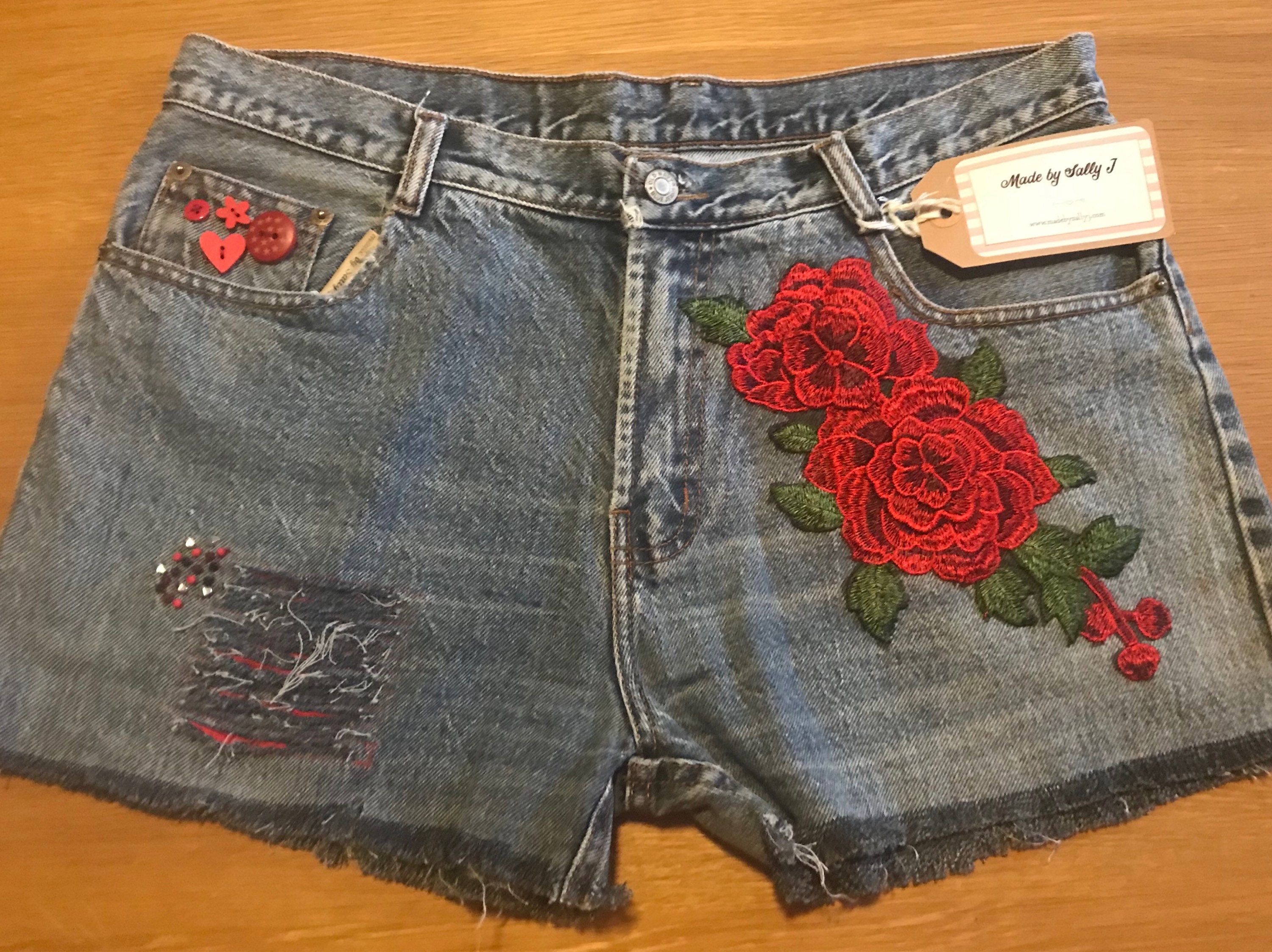 red distressed denim shorts