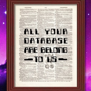 May include: A framed print with a vintage dictionary page background. The text "ALL YOUR DATABASE ARE BELONG TO US" is printed in a pixelated font.