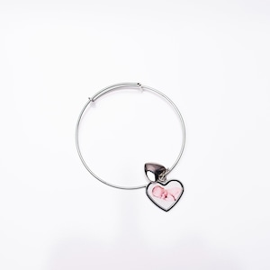 May include: A silver expandable bracelet with a heart-shaped charm featuring a photo of a baby.