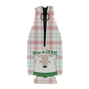 May include: Pink and green plaid can cooler with a zipper closure and a white polar bear with a green scarf. The cooler has the text "Keep it COOL" printed on it.