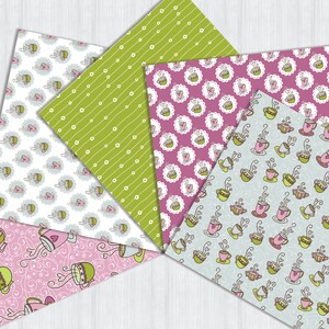 May include: A collection of patterned papers with various designs. The patterns include green with white dots and lines, pink with teacups, and light blue with teacups. Other papers have teacups with hearts and swirls.