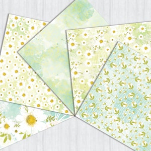 May include: Five different patterned papers with a floral theme. The papers feature white daisies, green leaves, and a light blue watercolor background.