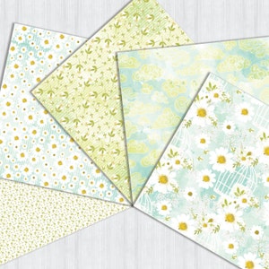 May include: Five different patterned papers with a green and white color scheme. The patterns include small white flowers, green leaves, white clouds on a blue background, and large white flowers on a blue background.