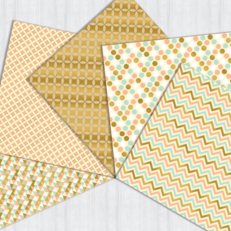 May include: Five patterned paper sheets in a variety of geometric designs. The papers feature a gold, peach, and mint green color scheme.