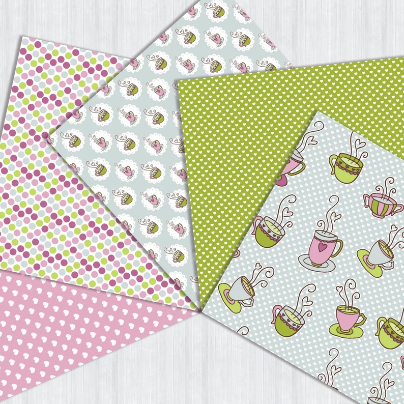 May include: A collection of patterned papers in pink, green, and blue. Designs include polka dots, hearts, and teacups with steam. The papers are arranged in a fan shape, showcasing the variety of patterns.