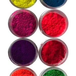 May include: Eight small jars of neon pigment powder in various colors, including yellow, blue, pink, purple, red, orange, and green.