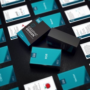 May include: A set of teal blue graphic design flashcards with black text. The cards are in a box that says "Graphic Design Flashcards".