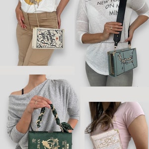 K&ouml;nnte beinhalten: Vier verschiedene buchf&ouml;rmige Handtaschen mit verschiedenen Designs. Die erste Tasche ist cremefarben mit goldenen Akzenten und tr&auml;gt den Text "Pride and Prejudice" von Jane Austen. Die zweite Tasche ist blau mit goldenen Akzenten und tr&auml;gt den Text "The Secret Garden" von Frances Hodgson Burnett. Die dritte Tasche ist gr&uuml;n mit goldenen Akzenten und tr&auml;gt den Text "TAIWAN PASSPORT". Die vierte Tasche ist cremefarben mit goldenen Akzenten und tr&auml;gt den Text "Persuasion" von Jane Austen.