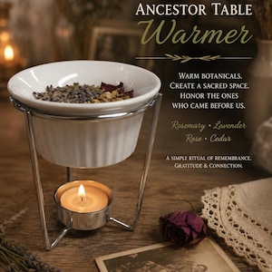 May include: A white ceramic bowl sits on a chrome metal stand with a lit tea light candle underneath. The bowl contains dried botanicals. Text on the image reads: ANCESTOR TABLE Warmer, WARM BOTANICALS. CREATE A SACRED SPACE. HONOR THE ONES WHO CAME BEFORE US. Rosemary • Lavender Rose • Cedar A SIMPLE RITUAL OF REMEMBRANCE, GRATITUDE & CONNECTION.