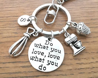 May include: Silver keychain with a charm that says "Do what you love, love what you do". The keychain also has charms of a cupcake, a mixer, and a whisk.