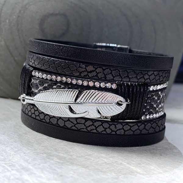 Bracelet de manchette à plume magnétique noir et argent avec accents de cristal