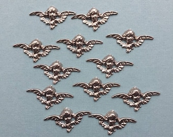 Mediuml winged angel face antique silver stamping with hollow back. Made in USA,48 x 24mm, Qty. 12 CC56
