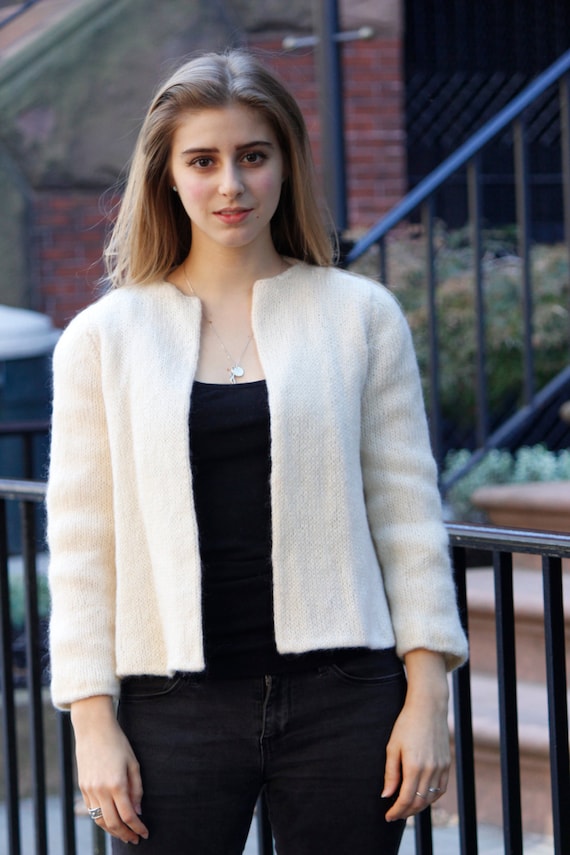 White, fuzzy, sweater jacket. Fully silk-lined, no