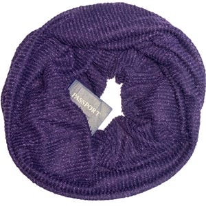 May include: A deep purple, circular scarf with a textured knit pattern. A small, rectangular tag with the word "PASSPORT" is tucked into the scarf. The scarf appears to be made of a soft, warm material.