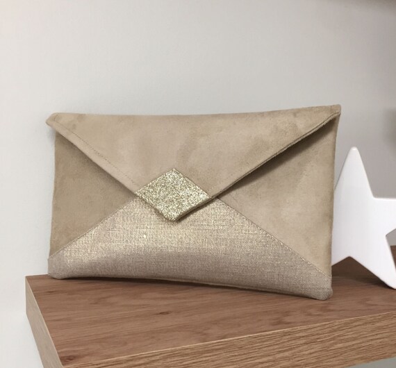 beige suede clutch