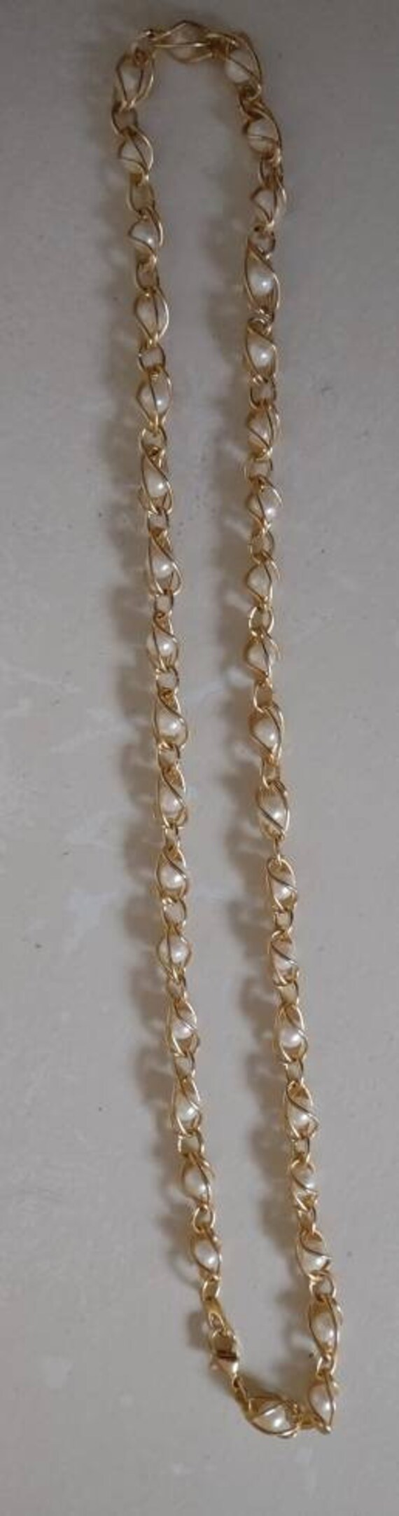 Gold Necklace Encasing Faux Pearls