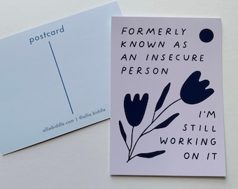 May include: A pink postcard with a black and white illustration of flowers and the text "FORMERLY KNOWN AS AN INSECURE PERSON I'M STILL WORKING ON IT".