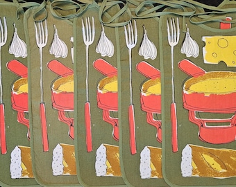 May include: A set of six olive green aprons with a retro food illustration. Each apron features a fork, garlic, a fondue pot, bread, cheese, and a wine bottle. The aprons have green ties.
