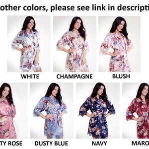 May include: A collection of seven satin robes featuring floral patterns and lace trim on the sleeves and hem. The robes are displayed in white, champagne, blush, dusty rose, dusty blue, navy, and maroon colors with the text For other colors, please see link in description!