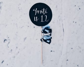 Cake Topper / Modern Calligraphy / Custom Hand Lettered/ Blue Silver Black / Made-To-Order/ Hand Made Mini Tassels / Birthday / Name Baby