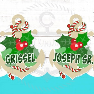 May include: Two Christmas-themed anchor ornaments with holly and red berries. The anchors are decorated with red and white candy cane stripes. The text "Grissel" and "Joseph Sr." is written on the anchors.