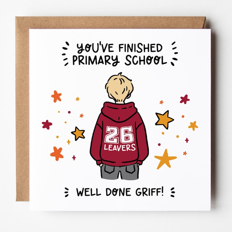May include: A greeting card with a brown envelope. The card features a cartoon illustration of a person in a maroon hoodie with the number 26 and the word "LEAVERS". Text reads "YOU'VE FINISHED PRIMARY SCHOOL" and "WELL DONE GRIFF!" with star accents.