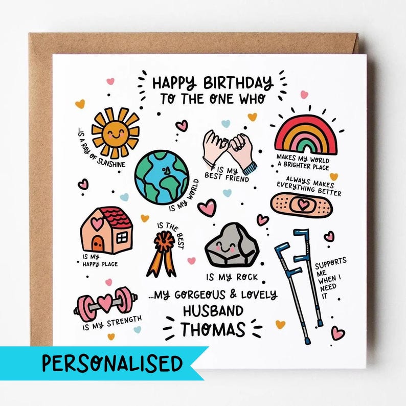 May include: A square greeting card featuring colorful hand-drawn illustrations including a sun, earth, pink house, ribbon, rock, dumbbell, rainbow, bandage, and crutches. Text reads: Happy Birthday to the one who is my gorgeous & lovely husband Thomas.