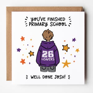 May include: A greeting card with a cartoon illustration of a person wearing a purple hoodie with the number 26 and the word "LEAVERS". The card reads "YOU'VE FINISHED PRIMARY SCHOOL" and "WELL DONE JOSH!" with star accents.