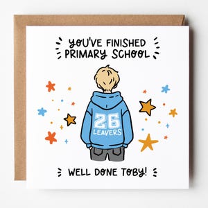 May include: A greeting card with a cartoon illustration of a child wearing a blue hoodie with the number 26 and the word "LEAVERS". The card reads "YOU'VE FINISHED PRIMARY SCHOOL" and "WELL DONE TOBY!" with star accents.