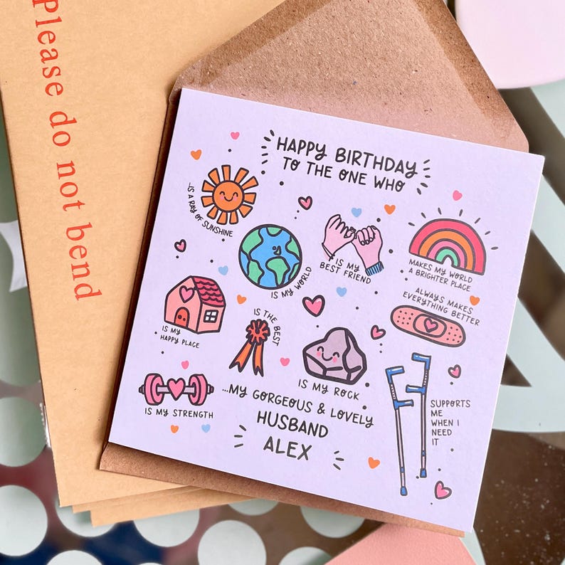 May include: A square greeting card with a light purple background featuring colorful hand-drawn illustrations and text. The card reads Happy Birthday to the one who is my ray of sunshine, my world, my best friend, my happy place, the best, my rock, my strength, and supports me when I need it, addressed to my gorgeous and lovely husband Alex.