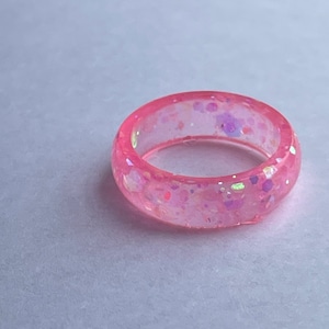 Pink glitter ring.