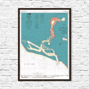 May include: A vintage nautical chart of Newport Bay, California, showing the coastline, waterways, and surrounding land features. The chart is printed on blue paper with brown lines and text. The chart includes depth soundings, navigational aids, and other important information for boaters.