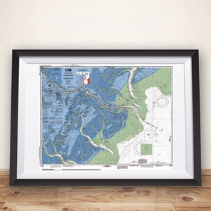 May include: A framed nautical chart of the Intracoastal Waterway, showing the waterways and surrounding land in blue, green, and brown. The chart is titled "Intracoastal Waterway, NC to FL, Section 1, 1:80,000".