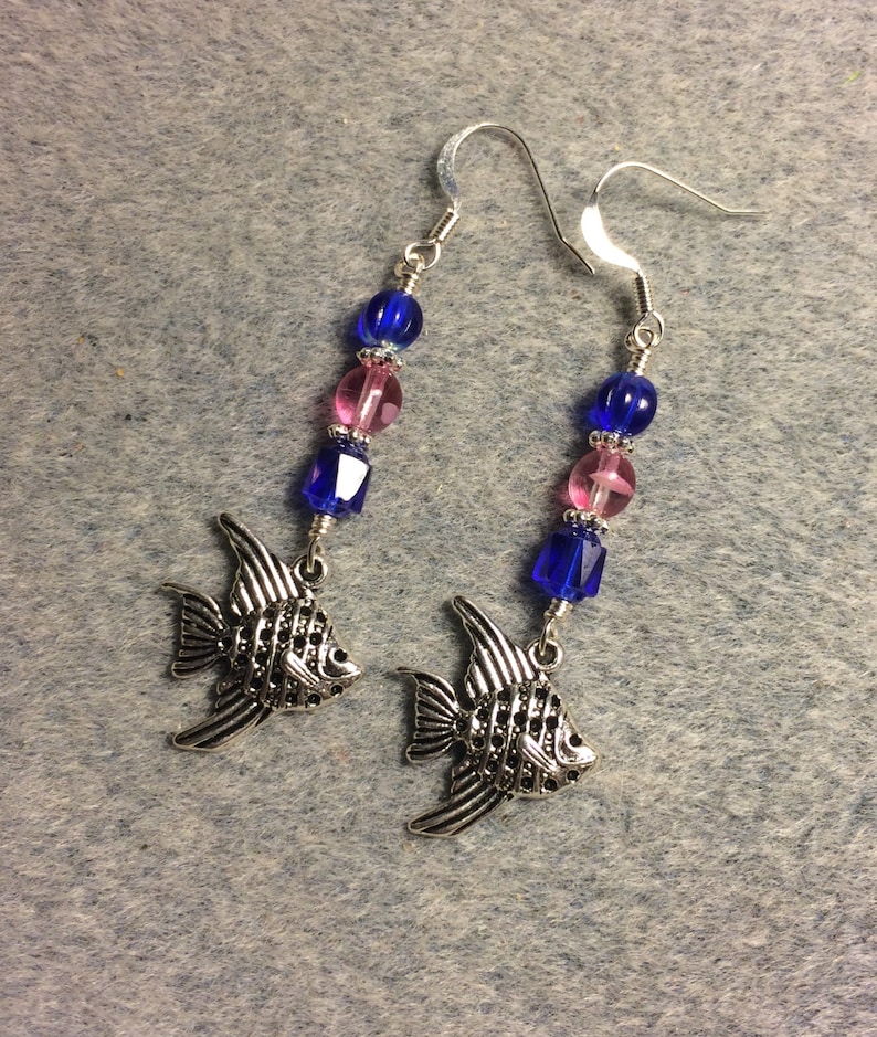 Silver angelfish charm dangle earrings adorned with cobalt blue and bright pink Czech glass beads.