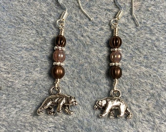 Small silver bear charm dangle earrings adorned with small brown Czech glass beads.