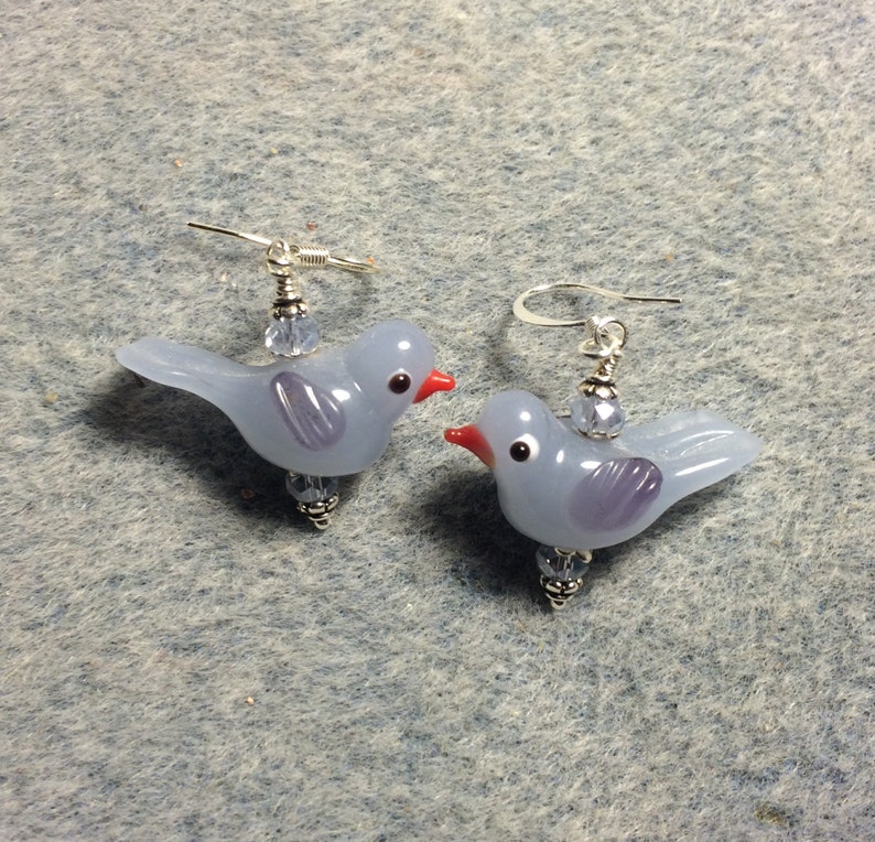 Milky light blue lampwork songbird bead earrings adorned with light blue Chinese crystal beads.
