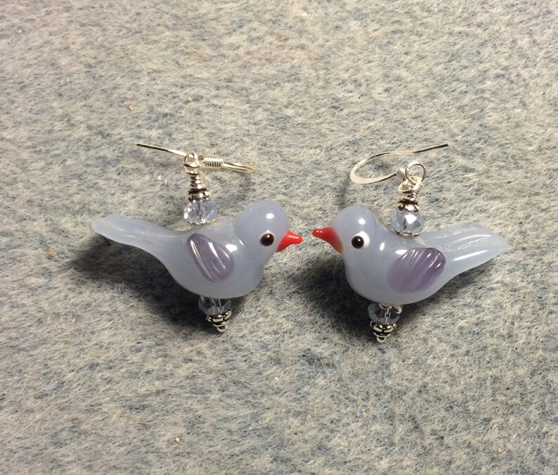 Milky light blue lampwork songbird bead earrings adorned with light blue Chinese crystal beads.