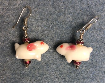 Small white and pink lampwork bunny rabbit earrings adorned with pink Czech glass beads.