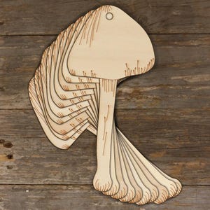 May include: A set of 10 unfinished wooden mushroom shapes with a hole at the top for hanging. The mushrooms are stacked on top of each other.