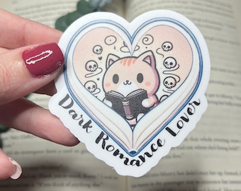 Dark romance lover sticker for those of us that like the darkness. Cute cat reading dark romance surrounded by a book shaped like a heart.