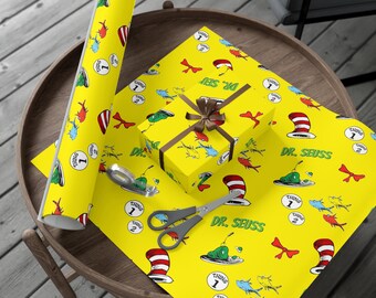 World of Seuss wrapping paper design includes Cat in the Hat, 1 fish 2 fish, thing 1 & thing 2, and green eggs