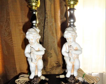 Vintage Set Of 2 Mid Century Porcelain Bisque Cherubs With A Flute Made In Italy Brass Ornate Metal Base Table Lamps